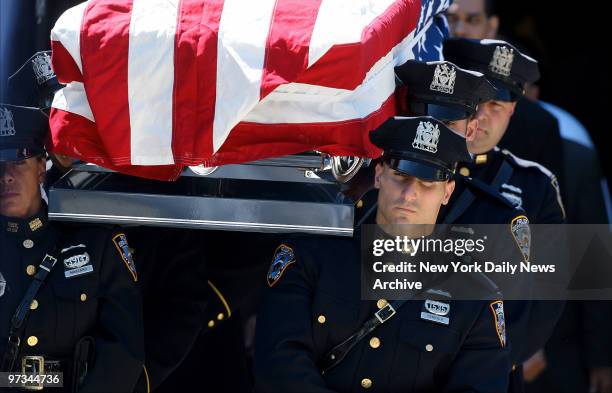 Police bear the coffin of their fallen comrade, NYPD Officer Eric Concepcion, during funeral services at St. Brendan's Church on E. 206th St. In the...