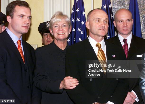 Police Commissioner Raymond Kelly stands with son Greg, wife Veronica and son James during his swearing-in ceremony at Gracie Mansion on Manhattan's...