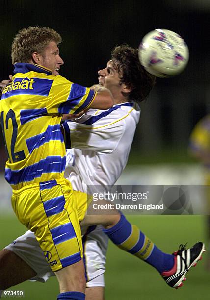 David Pilic of Brisbane collides with Nick Orlick of Parramatta during the round 18 National Soccer League match between the Brisbane Strikers and...