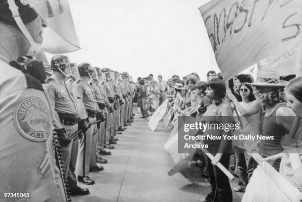 Police confront demonstrators at the Republican National Convention outside the Fontainebleau Hotel.