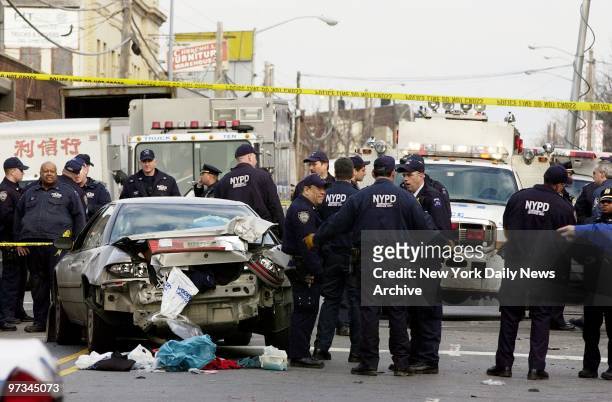 Police inspect the wreckage of a car at Woodward and Metropolitan Aves. In Queens after it was hit by a runaway locomotive. An unmanned locomotive...