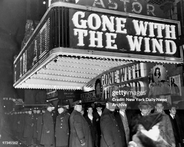 Police hold crowds back at Astor Theatre on opening night of the film "Gone With The Wind."