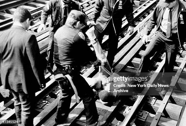 Police officer shoots Terence Middleton with Taser gun darts, stunning him after he allegedly tried to touch the third rail on the F line tracks at...