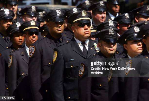 Police officers stand at attention during funeral of Police Officer Alexander Felix at Our Lady of Lourdes Church at 463 west 142nd Street. Felix was...