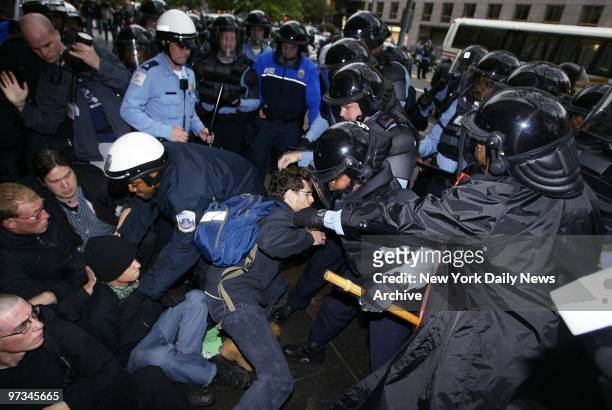 Police officers tussle with demonstrators protesting the policies of the International Monetary Fund and the World Bank during a march on K St. This...
