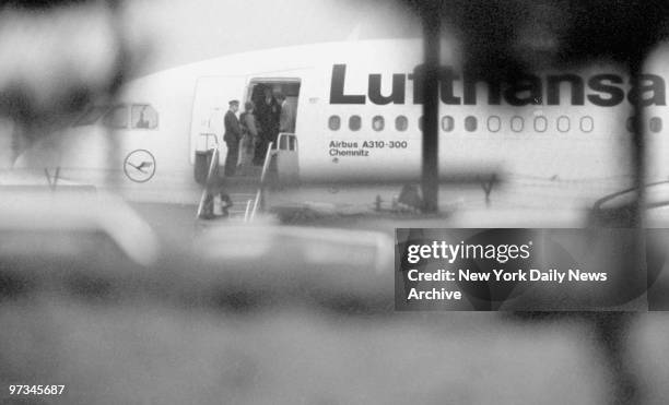 Police on steps of hijacked Lufthansa place after landing.