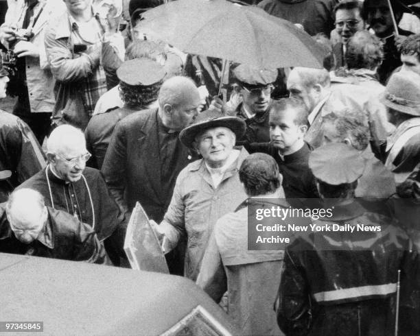 Pope John Paul II looks skyward as sun suddenly comes out during visit to St. James Cathedral in Downtown Brooklyn. Bishop Francis Mugavero...