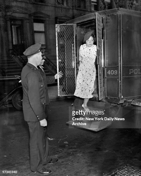 Polly Adler, known as the vice queen, leaving police van after being arrested in raid with Billie Tinsley. She was previoiusly held for possessing...
