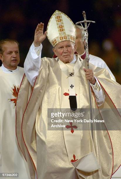 Pope John Paul II waves to crowd at Giants Stadium.
