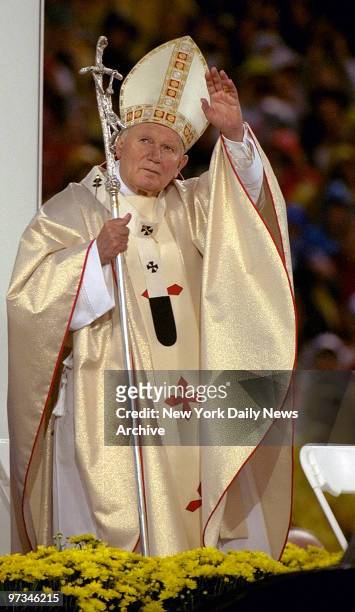 Pope Paul John II waves to crowd at Giants Stadium.