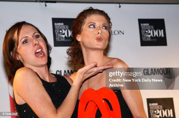 Presenter Molly Shannon and winner Debra Messing ham it up at the Glamour Magazine "Women of the Year" Awards at the Metropolitan Museum of Art.