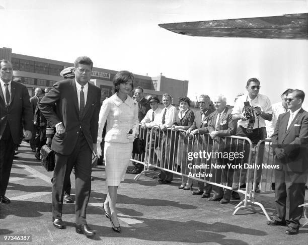 President and Mrs. John F. Kennedy leave Laguardia Airport on their way to vacation in Newport, RI