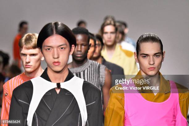 Model walks the runway at the Alex Mullins Spring/Summer 2019 fashion show during London Fashion Week Men's June 2018 on June 10, 2018 in London,...