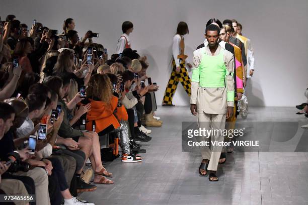 Model walks the runway at the Alex Mullins Spring/Summer 2019 fashion show during London Fashion Week Men's June 2018 on June 10, 2018 in London,...