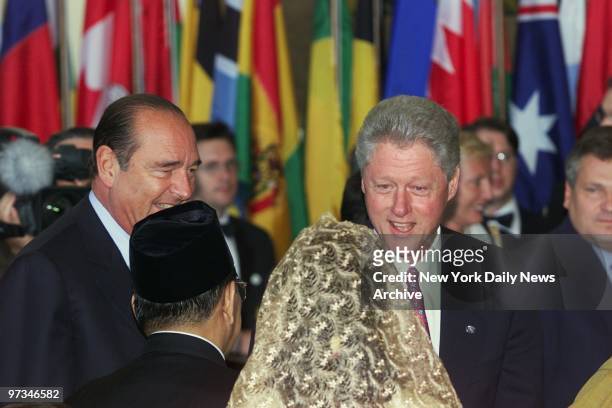 President Bill Clinton greets people arriving at luncheon for world leaders attending the United Nations Millennium Summit. France's President...