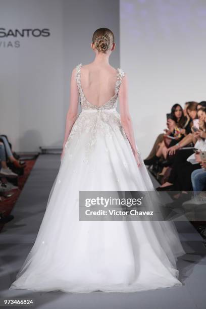 Model walks the runway wearing Benito Santos brides collection during the Mexico Bridal Show by Vogue at Four Seasons hotel on June 13, 2018 in...