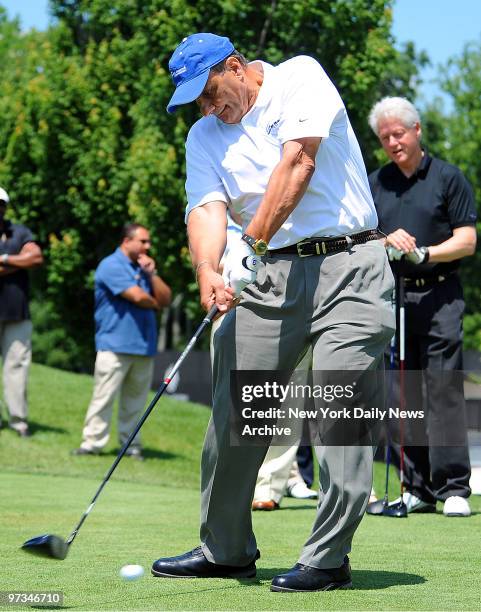 President Bill Clinton watches as Joe Torre tees offat Trump National Golf Club in Briarcliff Manor, NY for the Joe Torre Safe at Home Foundation,...