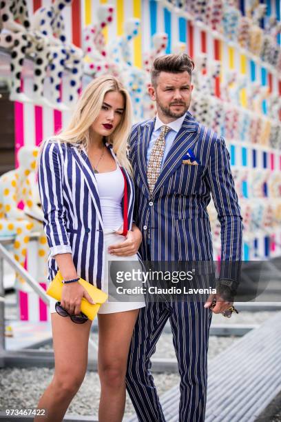 Guests, wearing striped blazer and striped suit, are seen during the 94th Pitti Immagine Uomo at Fortezza Da Basso on June 13, 2018 in Florence,...