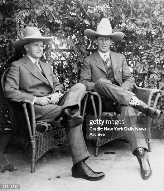 President Calvin Coolidge and champion bronco buster "Dakota" Clyde Jones at the White House.