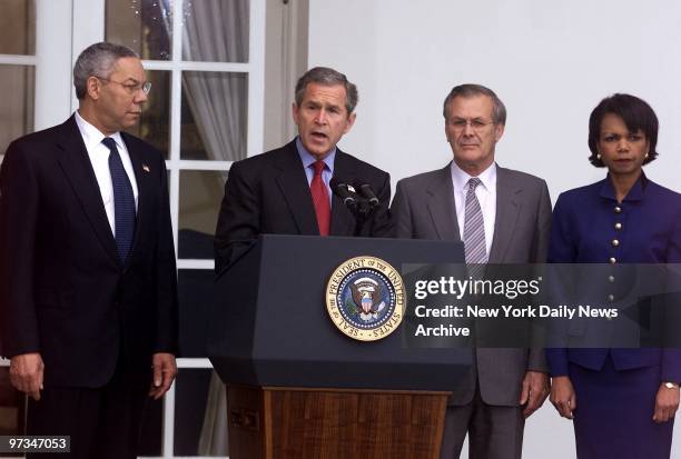 President George W. Bush speaking in the Rose Garden, on the withdrawal of the United States from the 1972 Strategic Arms treaty. Looking on are...