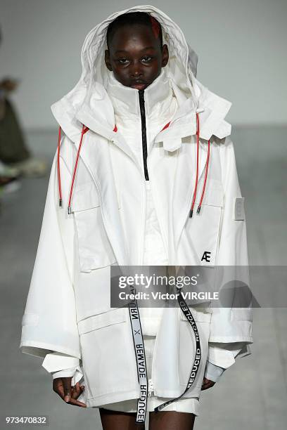 Model walks the runway at the Christopher Raeburn Spring/Summer 2019 fashion show during London Fashion Week Men's June 2018 on June 10, 2018 in...