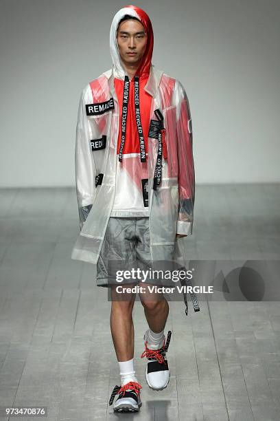 Model walks the runway at the Christopher Raeburn Spring/Summer 2019 fashion show during London Fashion Week Men's June 2018 on June 10, 2018 in...