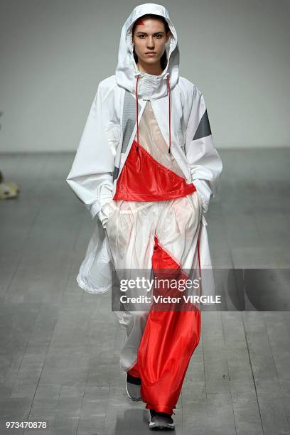 Model walks the runway at the Christopher Raeburn Spring/Summer 2019 fashion show during London Fashion Week Men's June 2018 on June 10, 2018 in...