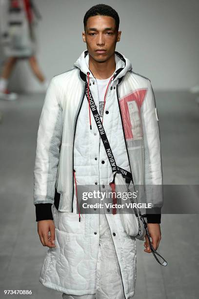 Model walks the runway at the Christopher Raeburn Spring/Summer 2019 fashion show during London Fashion Week Men's June 2018 on June 10, 2018 in...