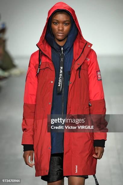 Model walks the runway at the Christopher Raeburn Spring/Summer 2019 fashion show during London Fashion Week Men's June 2018 on June 10, 2018 in...