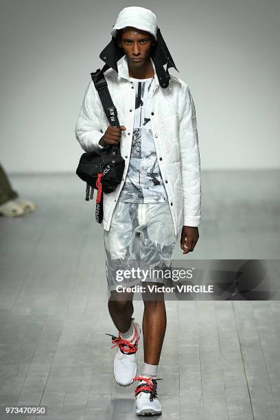 Model walks the runway at the Christopher Raeburn Spring/Summer 2019 fashion show during London Fashion Week Men's June 2018 on June 10, 2018 in...