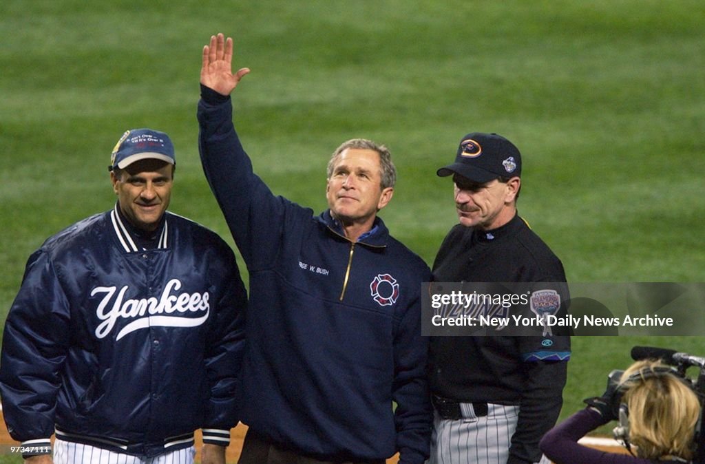 President George W. Bush, standing with New York Yankees' ma