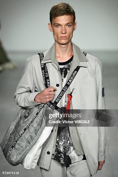 Model walks the runway at the Christopher Raeburn Spring/Summer 2019 fashion show during London Fashion Week Men's June 2018 on June 10, 2018 in...