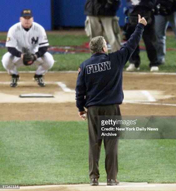 President George W. Bush, wearing FDNY jacket, gives crowd thumb up before throwing out cermonial first pitch during Game 3 of the World Series...