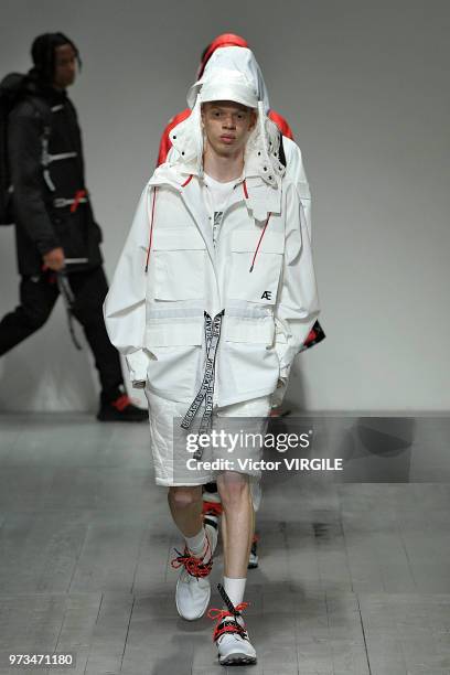 Model walks the runway at the Christopher Raeburn Spring/Summer 2019 fashion show during London Fashion Week Men's June 2018 on June 10, 2018 in...