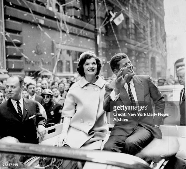 President John F. Kennedy and wife Jacquline ride up Broadway in New York City.