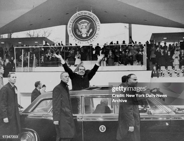 President Richard Nixon stands in car during the Inaugural Parade.