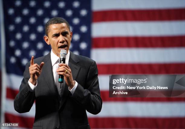 Presidential candidate Sen. Barack Obama stands against the backdrop of an American flag as he speaks during a campaign rally at the University of...