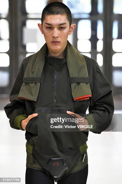 Model walks the runway at the Xander Zhou Spring/Summer 2019 fashion show during London Fashion Week Men's June 2018 on June 10, 2018 in London,...