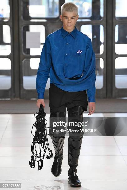 Model walks the runway at the Xander Zhou Spring/Summer 2019 fashion show during London Fashion Week Men's June 2018 on June 10, 2018 in London,...