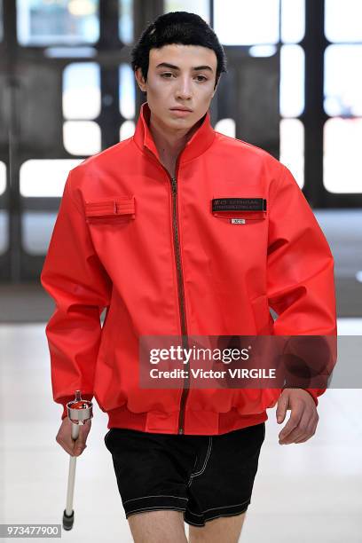 Model walks the runway at the Xander Zhou Spring/Summer 2019 fashion show during London Fashion Week Men's June 2018 on June 10, 2018 in London,...