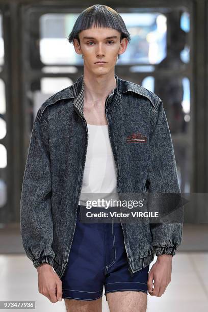 Model walks the runway at the Xander Zhou Spring/Summer 2019 fashion show during London Fashion Week Men's June 2018 on June 10, 2018 in London,...