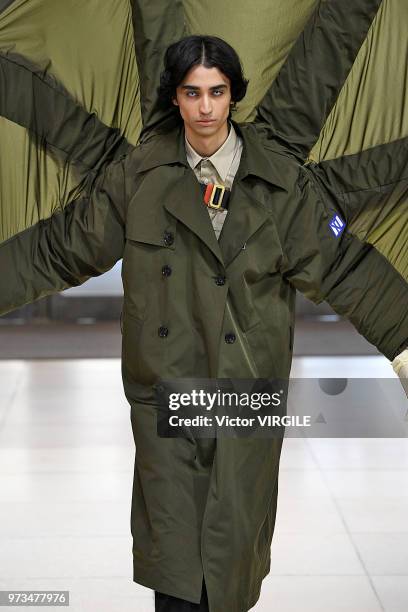 Model walks the runway at the Xander Zhou Spring/Summer 2019 fashion show during London Fashion Week Men's June 2018 on June 10, 2018 in London,...