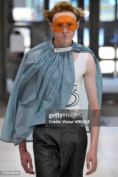 Model walks the runway at the Xander Zhou Spring/Summer 2019 fashion show during London Fashion Week Men's June 2018 on June 10, 2018 in London,...