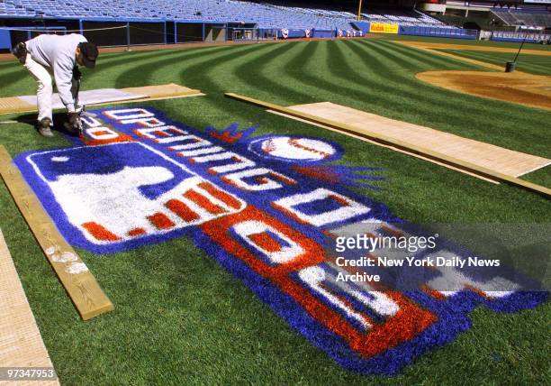 Randy Fila paints a welcome sign in prepartion for the New York Yankees' home opener at Yankee Stadium.