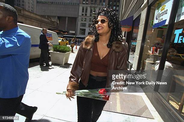 Prostitute Divine Brown takes a stroll along 42nd. St. Looking for actor Hugh Grant, who is filming his new movie.
