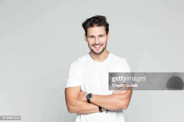 young man standing confidently - caucasian man face stock pictures, royalty-free photos & images