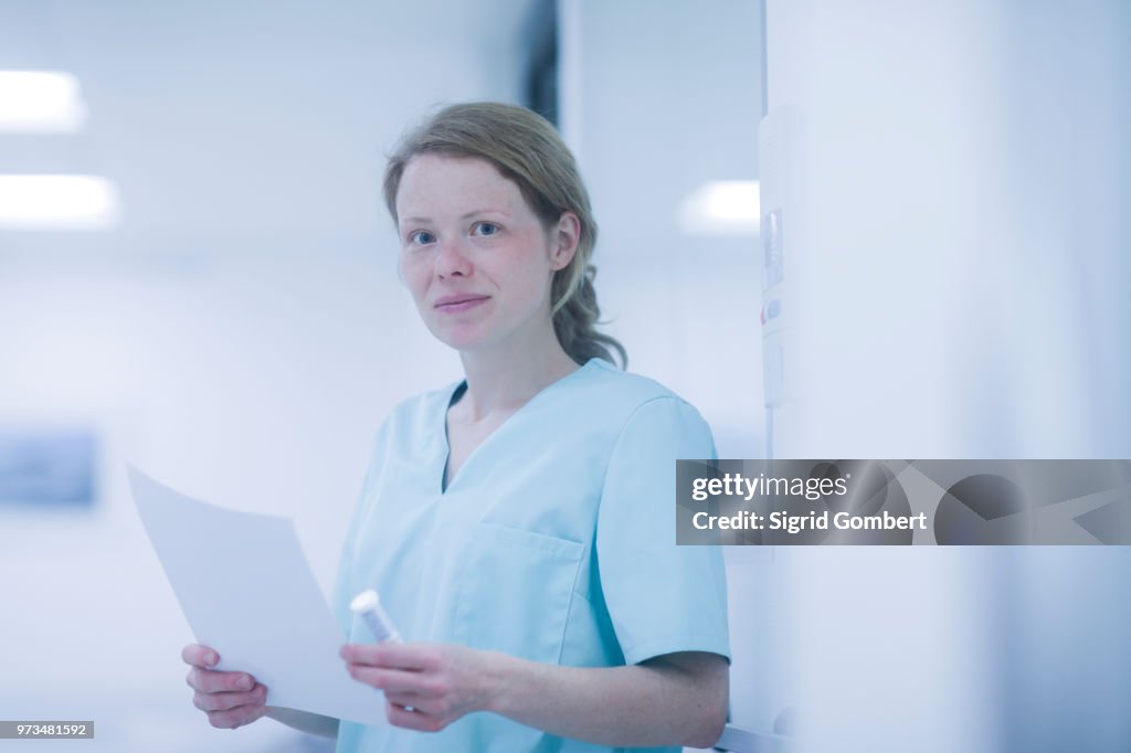 Portrait of radiologist, holding document