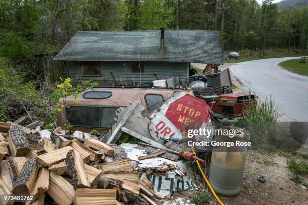 Dilapidated or run-down homes dot the nearby hollows and wooded backroads outside the downtown area on May 7, 2018 near Asheville, North Carolina....