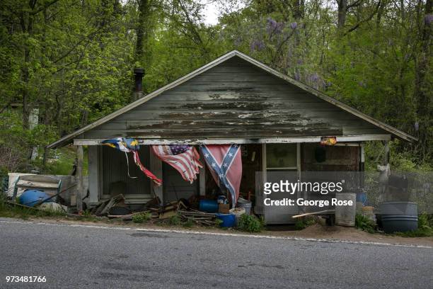 Dilapidated or run-down homes dot the nearby hollows and wooded backroads outside the downtown area on May 7, 2018 near Asheville, North Carolina....