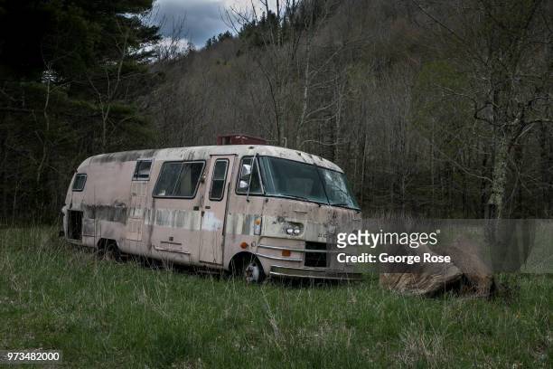 Dilapidated or abandoned cars dot the nearby hollows and wooded areas outside the downtown area on May 7, 2018 in Asheville, North Carolina. Located...
